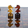 Шахматы с инкрустацией и фигурами из янтаря "Орион" 32х32 см, фотография 4. Интернет-магазин ЛАВКА ПОДАРКОВ