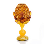 0059840-НП /10см Изделия из янтаря ЯЙЦО пасхальное оплетенное "КАМНИ" на подставке 